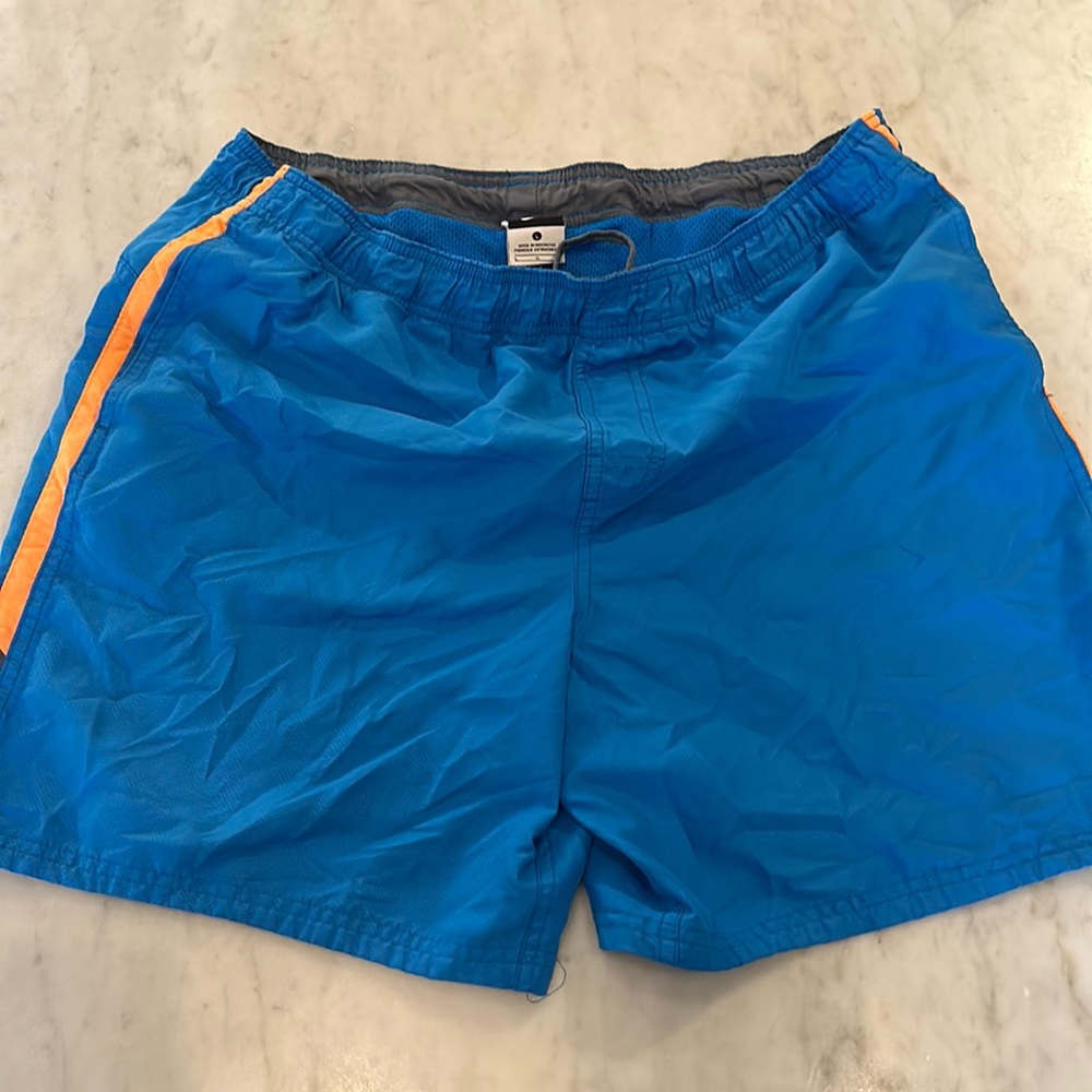 Nike swim trunks, size large, blue with orange trim.